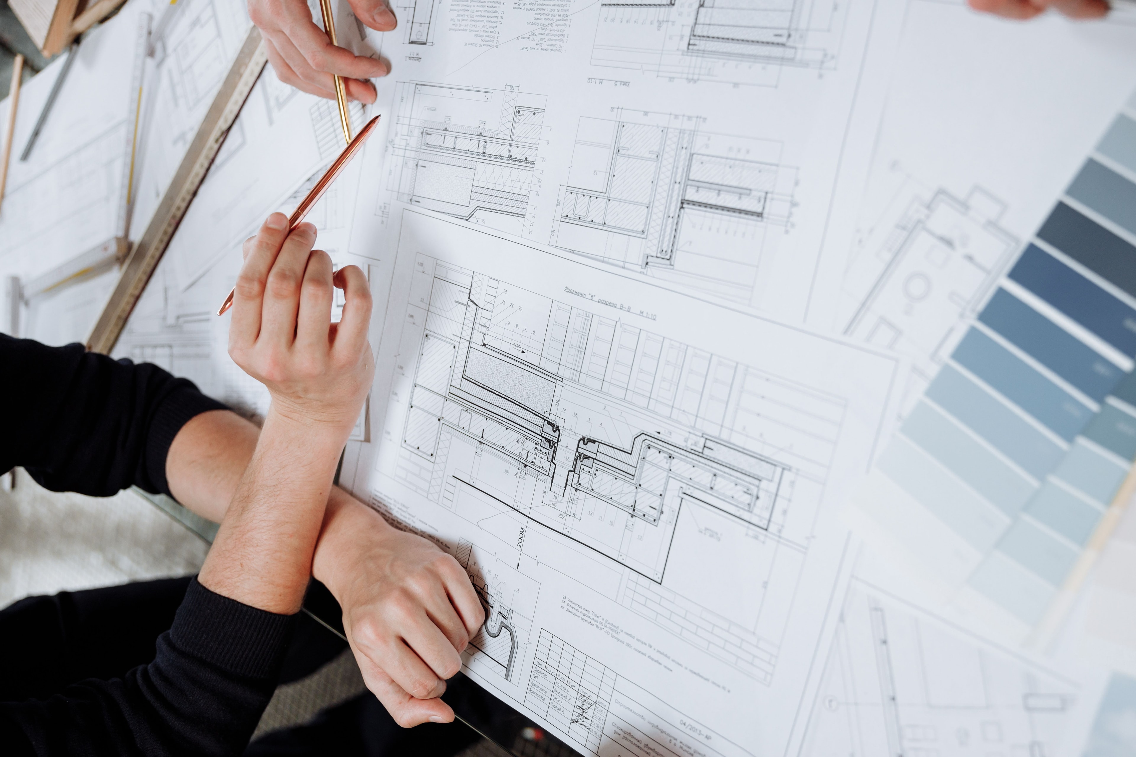 Engineers reviewing architectural blueprints